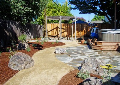 confluence ecological landscaping, installation of mulch, pathway, and flagstone patio in backyard